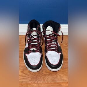 Nike Black and White High-Top Sneakers with Red Accents